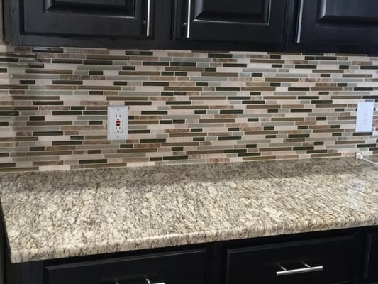 Granite countertops and stone/glass mix backsplash