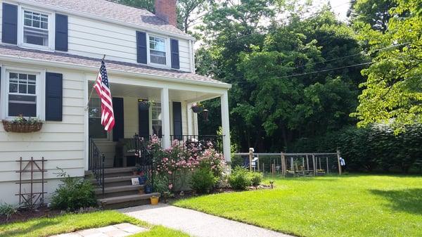 After: Painting, Landscaping, Built Fence, and Cement Work.