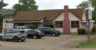 front view of parking lot and building where Alterations by Josephine is located