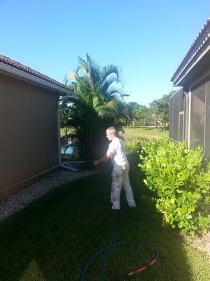 Pressure washing stucco house in Naples FL.