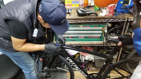 Mr. Omar Cossio building a high end bycicle.