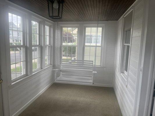 Shiplap walls with breadboard ceiling and lantern style lighting