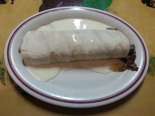 $9.00 Burrito Macho - 3 Stars - Great, clean presentation and decent steak filler. Comes with boring beans and rice.