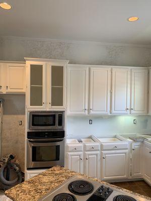 Kitchen cabinet stained to painted with snowbound color