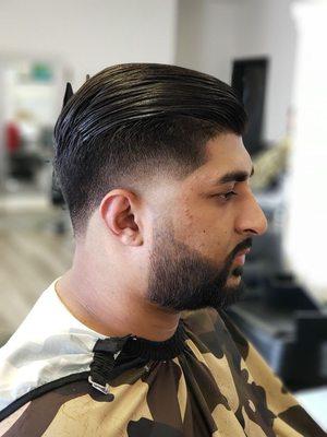 Tapet fade with comb over and beard line up