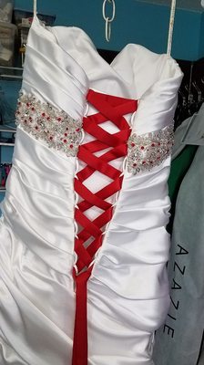 Added a corset and red stones to a wedding gown