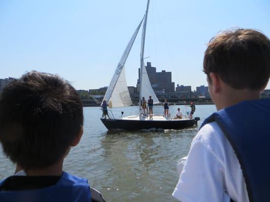 Uh Oh...looks like the other boat is ready with some squirt guns. Keeping cool on a summer day during sailing camp in NYC.