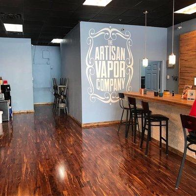 Custom Indoor Business Mural Wrap Sign for Artisan Vapor Company installed by sign shop company in Rowlett TX Signs and Designs TX.