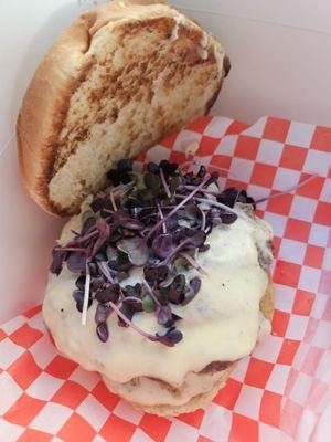 Double cheeseburger with grass-fed beef and microgreens