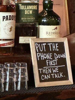 Sign behind the bar