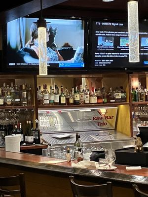 Bar, barely attended, with two TV screens showing "signal loss" alerts 40 minutes and no-one fixing the problem