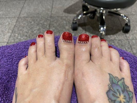 Sparkly gel pedi with rhinestones.