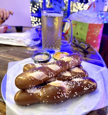 Pretzel sticks with cheese and mustard dipping sauces