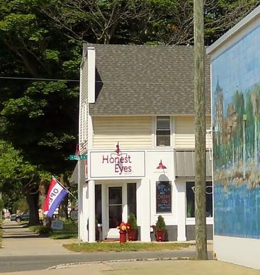 "Bring your own prescription" eyeglass store, next to Ace Hardware.  Also open "every other Saturday 12-4."