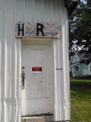 The store's Tacky looking Do-It-Yourself sign reads "Hidder Rummage".