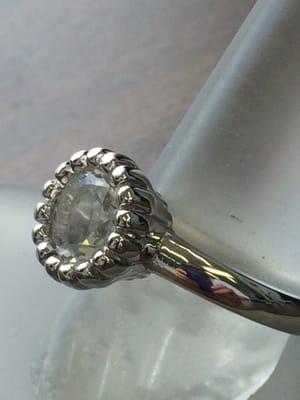 Dubbed, "the Rachel", this is a 14k White Gold engagement ring with an 8mm round, brilliant-cut White Topaz.