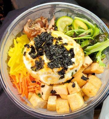 Bibimbap rice bowl with tofu and fried egg. Everything is extremely fresh tasting. Nice large portion. Delicious.