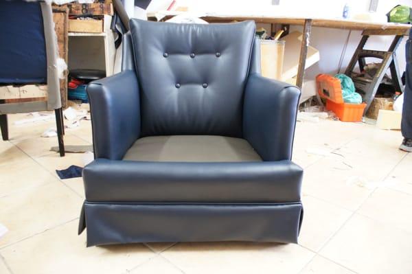 Sofa restoration with new blue vinyl. Sofa repair, sofa upholstery in Los Angeles at our local upholstery shop. by manny Lopez