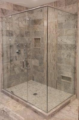 Completely Frameless shower enclosure with clear glass and through glass handles.