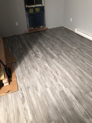 New Vinyl plank flooring over new subfloor and new floor joists.