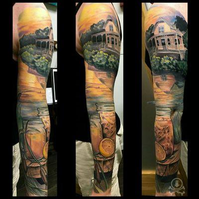 Peaceful country lake full sleeve tattoo by Meghan Patrick.