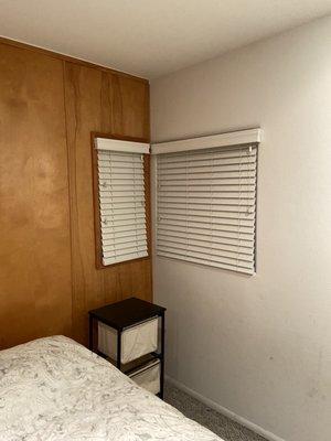 White faux wood blinds.