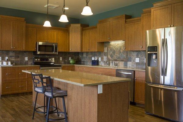 Share a home-like kitchen and dining area.