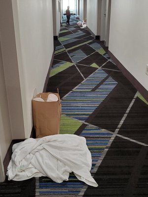 Trash lining the hallways because they "couldn't" clean rooms.