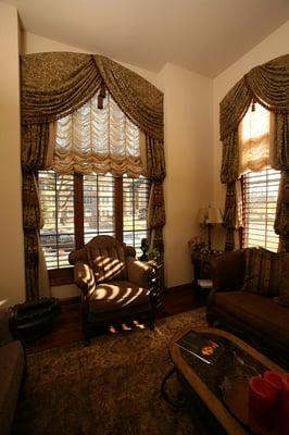 Austrian shades with arched valances and bishoped side panels.