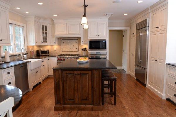 Gorgeous beaded inset, painted cabinetry. Knotty alder stained island cabinetry. Granite counter tops