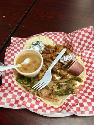 Amazing sweetbread tacos with grilled onions and peppers plus charro beans