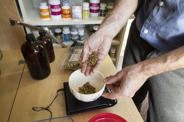 Mixing herbal formulas designed individually for patients needs.