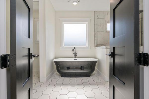 Entrance to master bath with satin black doors.