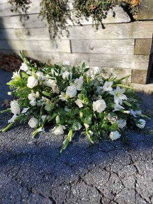 Beautiful all white casket spray