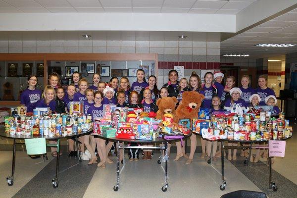 The Grimes Superstars Families love to give back! Here are a few of our 2017 dancers with items collected at our annual Christmas Show.