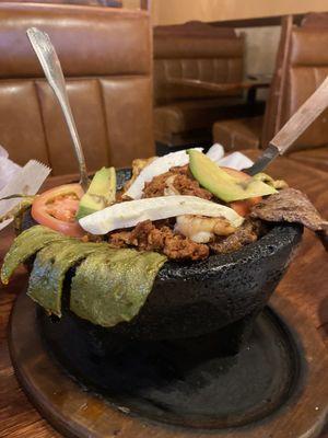 The molcajete up close! With chicken, steak, shrimp, cactus, and cheese. Plus a base of supeflavorful beans! Omgggg