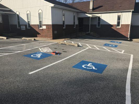 Freshly painted parking spaces with handicap to make the church for safety for the people