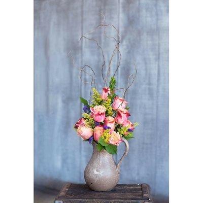 Custom floral arrangement in a piece of pottery