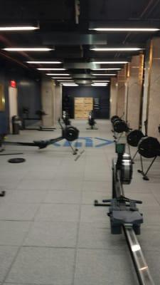 Studio space where the classes are held; the rowing machines can be put away for the other HIIT classes, etc.