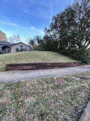 Retaining wall with railroad ties