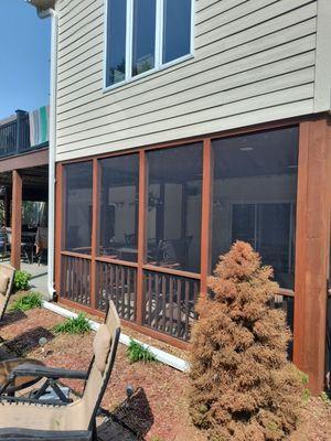 Custom screen porch added under sunroom to enjoy the outdoors but also not be bothered by mosquitoes or bees