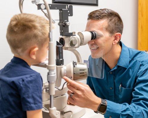 Dr Jason Foote performing a pediatric eye exam