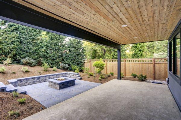 Newly installed paver patio, firepit and retaining wall.