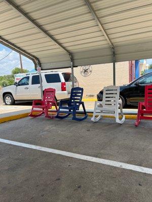 Shaded seating area. It's in the same parking lot as a gas station.