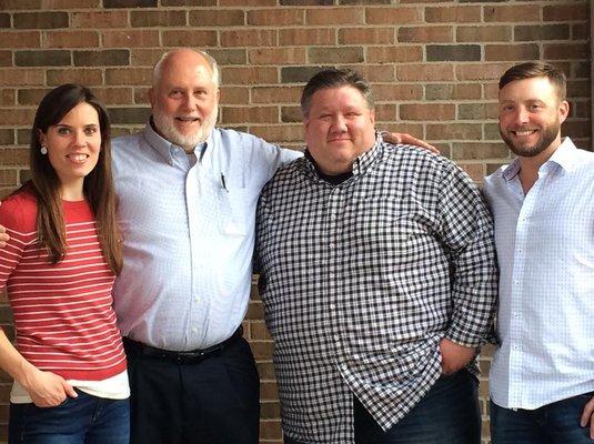 Long time owner Mike (2nd from left) with the new owners; Molly, Kurt, and Cory.