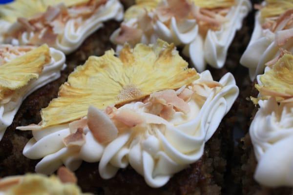 Naturally Organic Carrott Cake with ButterCream Icing adorned with Sundried Pineapple Flowers and Toasted Coconut - Gluten-Free