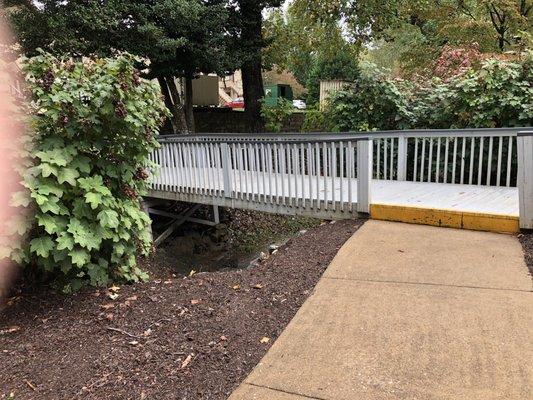 Bridge from one parking area over stream