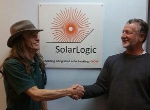 Shaking hands with Fred Milder of SolarLogicLLC in Sante Fe on my new distributorship.