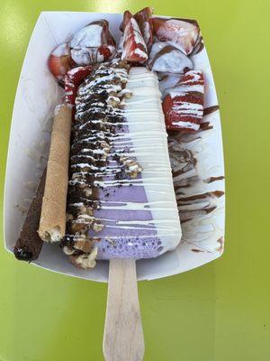 My customized paleta - taro half dipped in milk & white chocolate, topped w/ pecans & Oreos. a side of strawberries & wafers