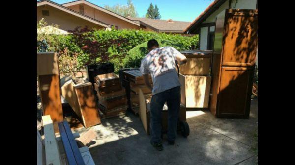 Jon Avila hauling granite countertops and cabinets for a happy customer